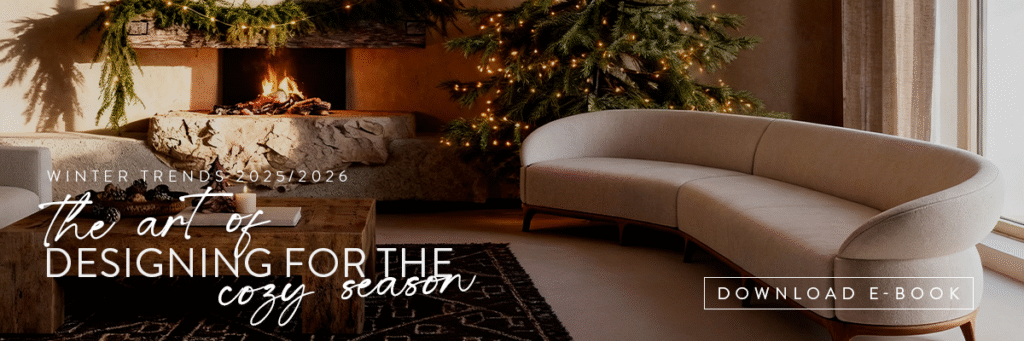 Curved Samara Sofa by Sentta in a cozy winter living room with a fireplace and Christmas tree, illustrating the art of designing for the cozy season.